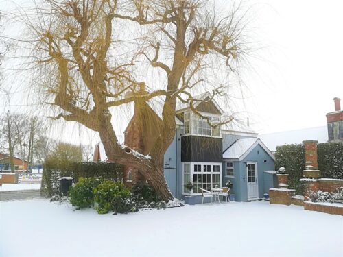 The Saddlery Holiday Cottage in the snow at Christmas