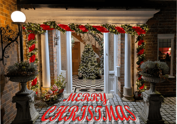 Image of the front door and hall at Sadlers with Merry Christmas message.