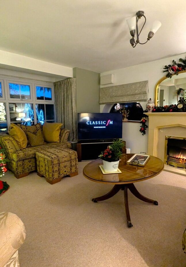A beautifully decorated Christmas tree stands proudly in the lounge.